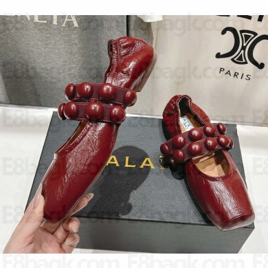 Alaïa calfskin Sphere-Detail Ballet Flats burgundy 2025