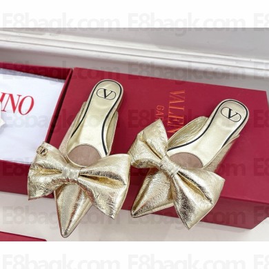 Valentino Garavani metal skin mules with bow gold 2025