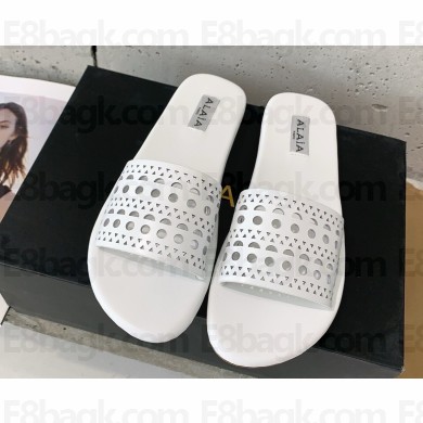 ALAÏA Vienne Cutout Flat Slide Sandals In white leather 2025