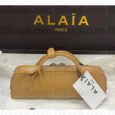 Alaïa LE TECKEL CLUTCH IN SHINY GOATSKIN light yellow 2025
