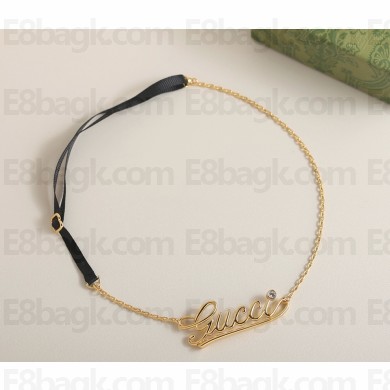 GUCCI Chain headband with Gucci script in yellow gold-toned metal 2025
