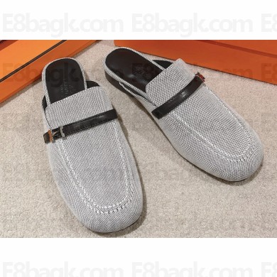 Hermes Groupie mules in H canvas and calfskin with miniature permabrass-plated Paris buckle