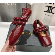 Alaïa calfskin Sphere-Detail Ballet Flats burgundy 2025