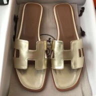 Hermes Oran Flat Slipper Sandals in Metallic Leather Gold