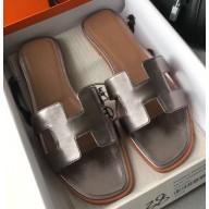 Hermes Oran Flat Slipper Sandals in Metallic Leather Gun Color