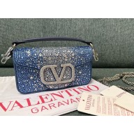 Valentino Garavani small Locò studded denim shoulder bag 01 2024