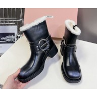 Miu Miu leather Shearling biker boots in black 2024