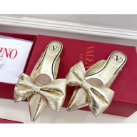 Valentino Garavani metal skin mules with bow gold 2025