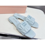 MIU MIU Matelassé nappa leather slides 5XX605 light blue 2025