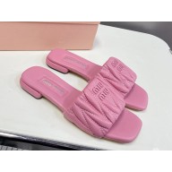 MIU MIU Matelassé nappa leather slides 5XX605 pink 2025