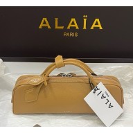 Alaïa LE TECKEL CLUTCH IN SHINY GOATSKIN light yellow 2025