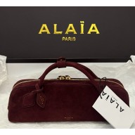 Alaïa  LE TECKEL CLUTCH IN SUEDE GOATSKIN burgundy 2025