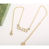 'GUCCI' letter necklace 774693 Antique gold-toned metal Gucci script with crystals 2025