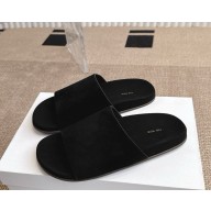 The Row Hugh Slide in Suede black 2025
