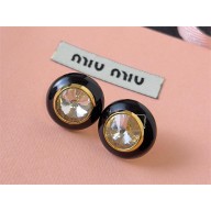 Miu Miu Plexiglas and metal earrings 2024