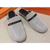 Hermes Groupie mules in H canvas and calfskin with miniature permabrass-plated Paris buckle