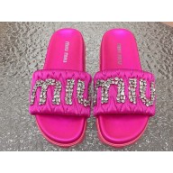 Miu Miu Matelassé Satin slides Fuchsia with Crystal Logo 2024