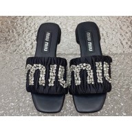 Miu Miu Matelassé Satin Heel slides Black with Crystal Logo 2024