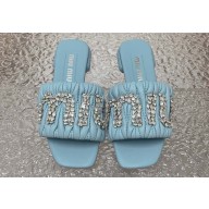 Miu Miu Matelassé nappa leather Heel slides Blue with Crystal Logo 2024