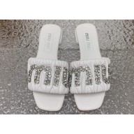 Miu Miu Matelassé nappa leather Heel slides White with Crystal Logo 2024