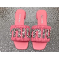 Miu Miu Matelassé nappa leather Heel slides Pink with Crystal Logo 2024