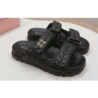 Miu Miu Matelassé nappa leather slides 5XX640 Black 2024