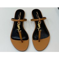 Saint Laurent cassandra slides in vegetable-tanned leather 776081 MARRON GOLD 2024