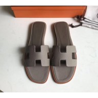 Hermes Oran Flat slippers in epsom leather elephant gray with brown piping