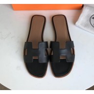 Hermes Oran Flat slippers in epsom leather black/brown