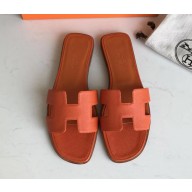 Hermes Oran Flat slippers in epsom leather orange with brown piping