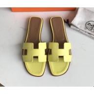 Hermes Oran Flat slippers in epsom leather lemon yellow/brown