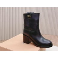 Miu Miu Fumé leather booties black 2023