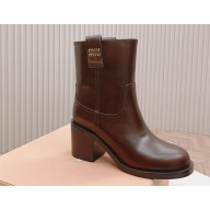 Miu Miu Fumé leather booties brown 2023