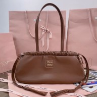 Miu Miu Joie nappa leather bag 5BG287 Cognac 2024