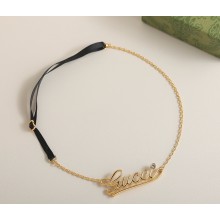 GUCCI Chain headband with Gucci script in yellow gold-toned metal 2025
