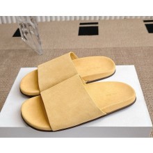 The Row Hugh Slide in Suede light yellow 2025