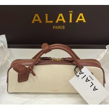 Alaïa LE TECKEL CLUTCH IN IN CANVAS AND NUBUCK UMBER 2025