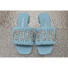 Miu Miu Matelassé nappa leather Heel slides Blue with Crystal Logo 2024