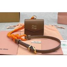 Miu Miu Leather, cord, and metal trick with mini-pouch bag 5TL515 Cognac/Orange 2024