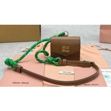 Miu Miu Leather, cord, and metal trick with mini-pouch bag 5TL515 Cognac/Green 2024