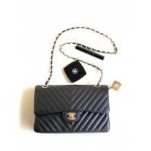 Chanel BLACK Chevron Medium Flap Bag in caviar leather With gold Hardware