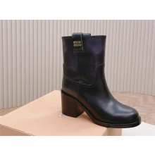 Miu Miu Fumé leather booties black 2023