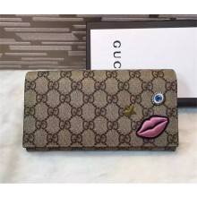 Gucci continental wallet with embroidered face 431394