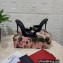 Dolce & Gabbana Heel 10.5cm Patent leather mules Black with DG logo 2023