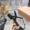 Miu Miu Patent thong sandals Black with metal lettering logo 2023