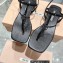 Miu Miu Patent thong sandals Black with metal lettering logo 2023
