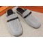 Hermes Groupie mules in H canvas and calfskin with miniature permabrass-plated Paris buckle
