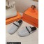 Hermes Groupie mules in H canvas and calfskin with miniature permabrass-plated Paris buckle