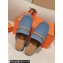 Hermes Groupie mules in denim Blue and calfskin with miniature permabrass-plated Paris buckle