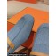 Hermes Groupie mules in denim Blue and calfskin with miniature permabrass-plated Paris buckle